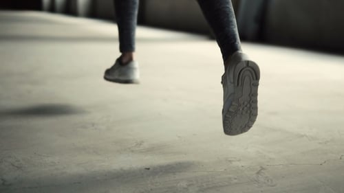 Legs Running in Athletic Shoes