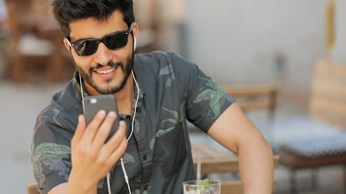 Man Having Video Call in Street