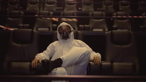 Hazmat Suited Person in an Empty Movie Theater