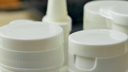 White Plastic Bottle with Medications or Pills