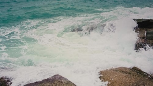Ocean Waves Crashing on Rocky Shoreline