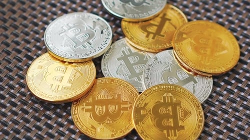 Shiny Bitcoin Cryptocurrency Coins on Woven Surface