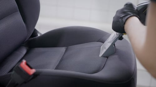 Shot of a Master Cleaning Car Seats Indoor.