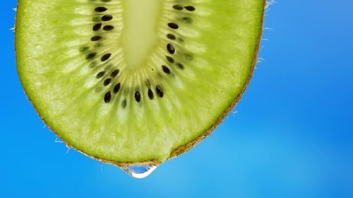Fresh Kiwi Slice with Dripping Water Droplet