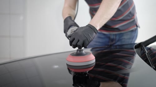 Shot of a Polished Black Car Hood in Carwash Station.