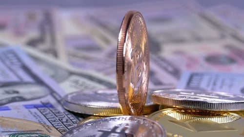Golden Bitcoin Coin Stands Tall on US Currency