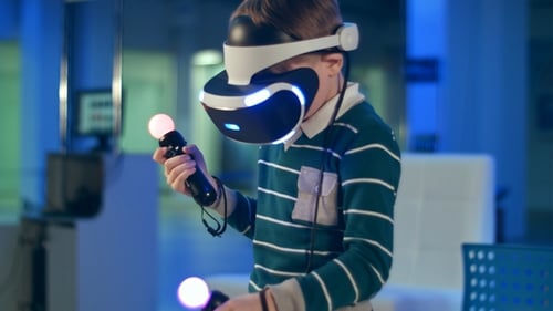 Child Immersed in Virtual Reality Gaming Experience