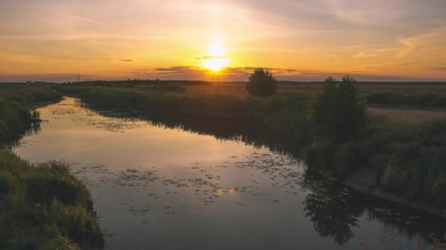 Summer Nature with a River at Sunset Time