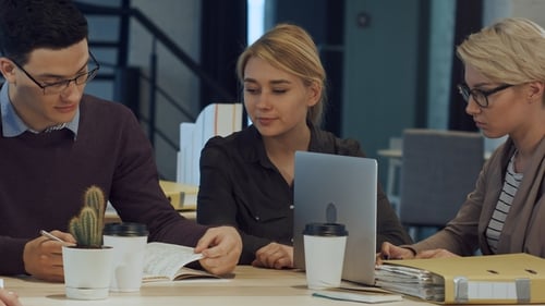 Creative People Doing a Brainstorming Meeting in a Modern Studio