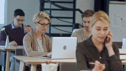 Busy Design Office with Workers at Desks