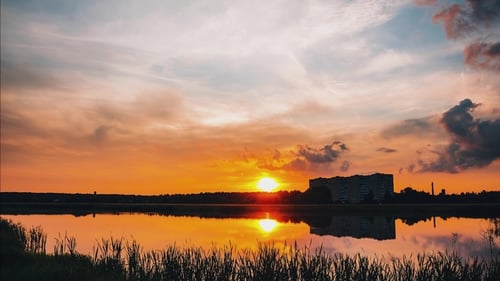 Sunset Behind the Lake on a Summer Evening