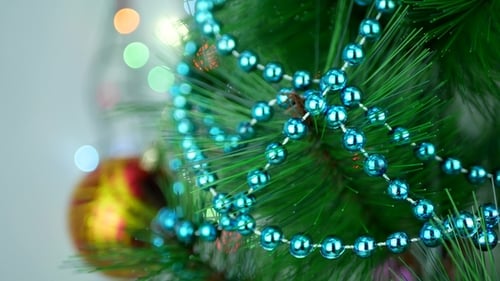 Christmas Tree Branch Decorated with Blue Beads