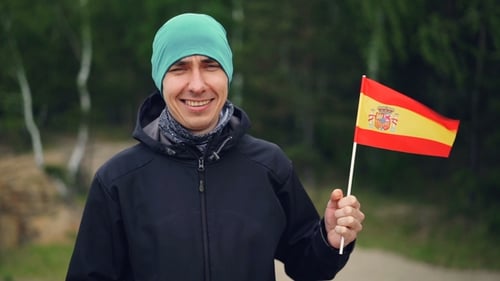Adult Waving Flag of Spain in Nature