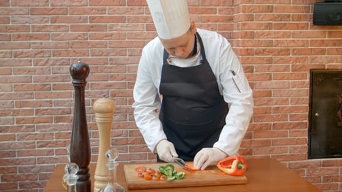 Chef Dicing Red Bell Pepper in Kitchen