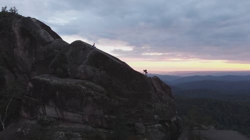 Aerial View of the People Climb To the Top of the Rock in the Siberian Nature Reserve Stolby