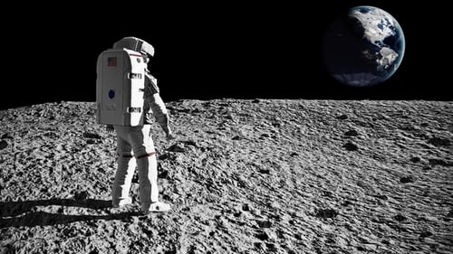 Astronaut Walks on Lunar Surface, Earth Visible in the Distance