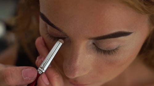 Process Applying Eyeshadows While Elegant Eye in Beauty Studio