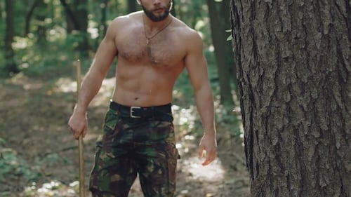 Portrait of Bearded Man with Ax in the Forest