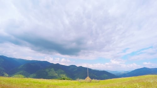 Summer Mountains Landscape with Haystack and Clouds