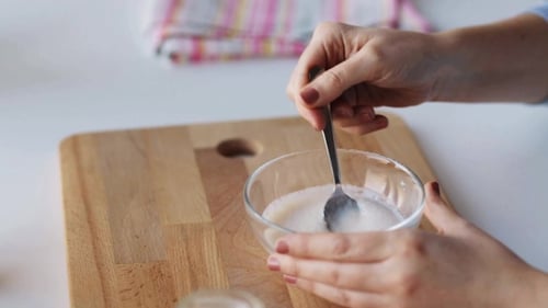 Woman Preparing Infant or Baby Formula for Feeding