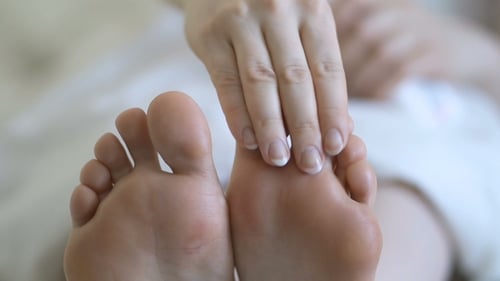 Woman Girl Taking Care of Her Dry Foot Skin Applying Moisturizing Cream
