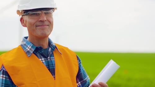 Successfull Engineer Doing Windmill Inspection