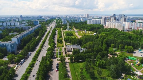 Large Park with Attractions in City Against Sky