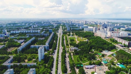 Large Green Park in City with Avenue and Streets