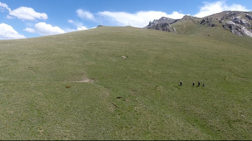 People in the top of the mountain