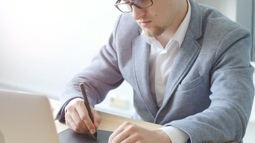 Young Adult Graphic Designer Works at Modern Desk