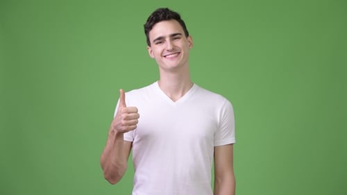 Young Adult Gives Thumbs Up Approval Sign