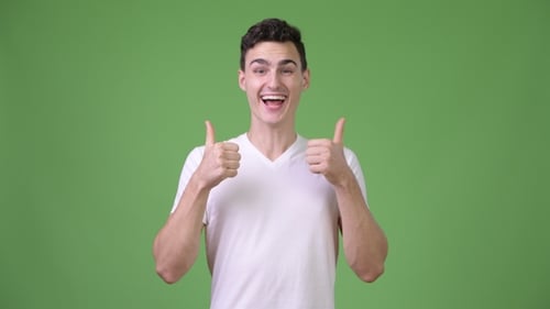 Man Smiles and Gives Two Thumbs Up