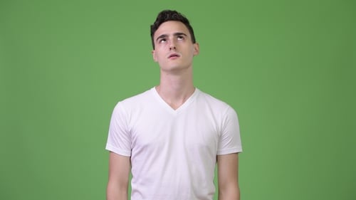 Young Adult Rolling Eyes in Front of Greenscreen