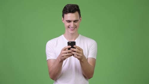 Young Handsome Man Using Phone