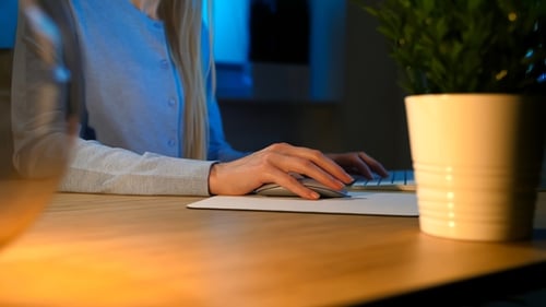 Female Working on Computer at Night