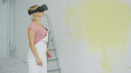 Woman Wearing VR Headset in Unfinished Room