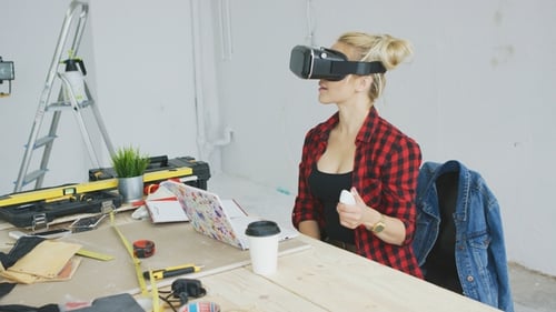 Woman Using VR Headset at Project Table
