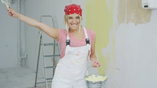 Woman with Paint Brush and Yellow Paint