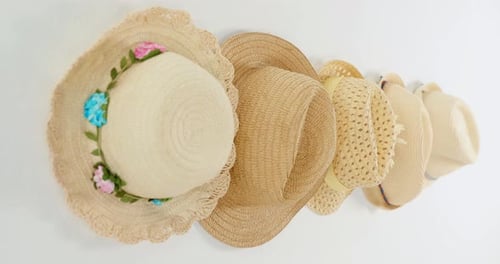 Stylish Straw Sun Hats on White Background