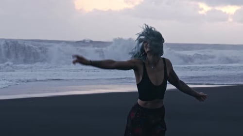 Dancing Cool Girl With Blue Hair On Beach