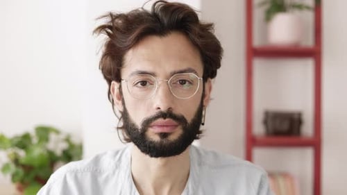 Close Up of Bearded Man with Round Glasses