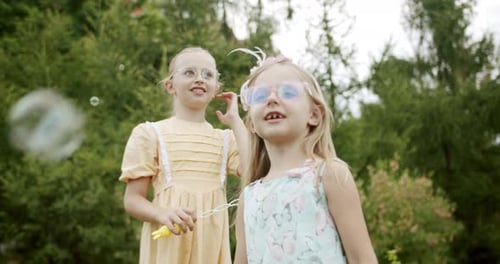 Child Catches Soap Bubbles in the Park Outdoors Kids Dream Concept Happy