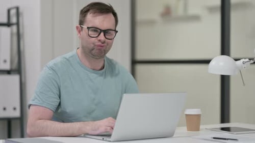 Man Using Laptop in Office Workplace