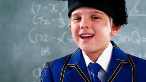 Smiling Child in Graduation Cap and Gown