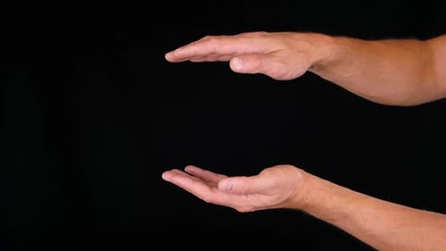 Hands Presenting on a Black Background