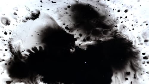 Ink blot spreading on a white background