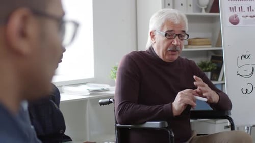 Man Teaching Math Formulas to Students