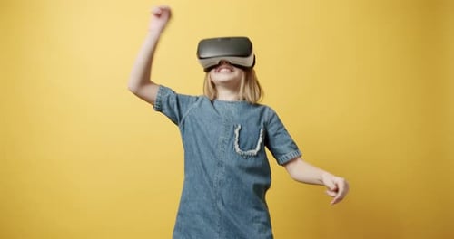 Child with VR Headset Playing Video Game
