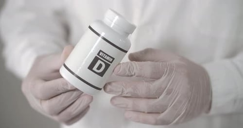 Vitamin D Box In Doctor's Hand