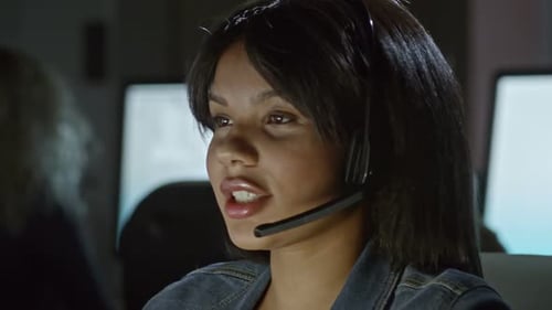 Woman with Headset Speaking at Work